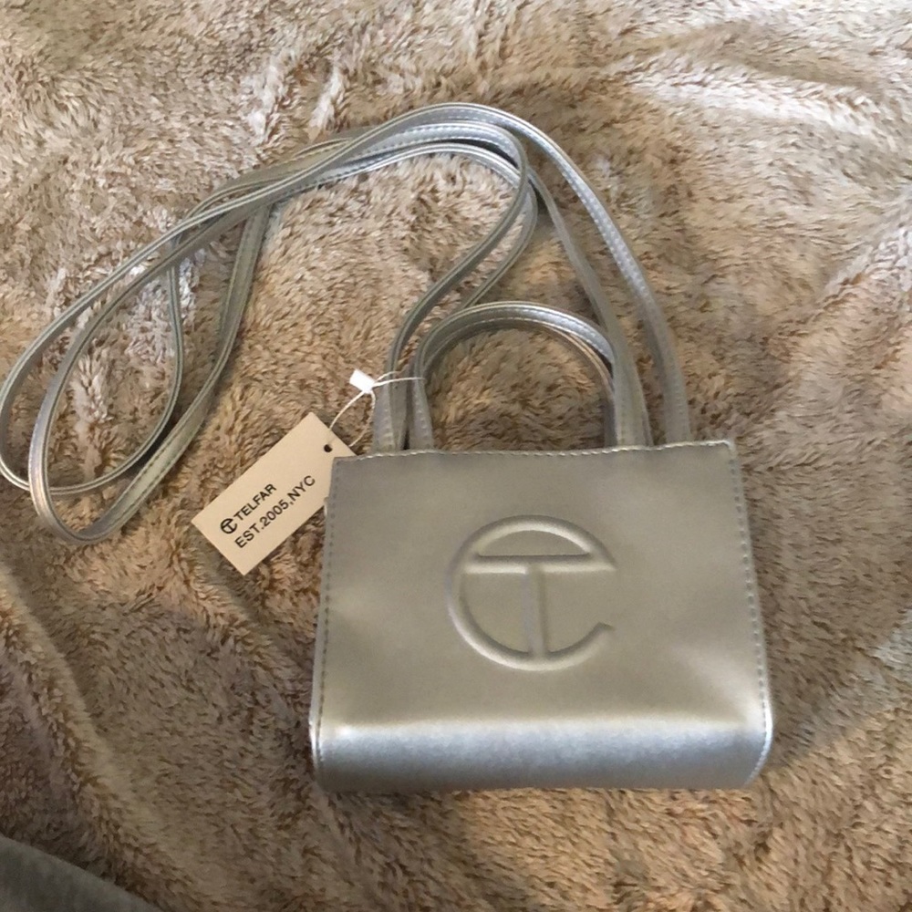 Silver Teflar bag , never worn 100% authentic